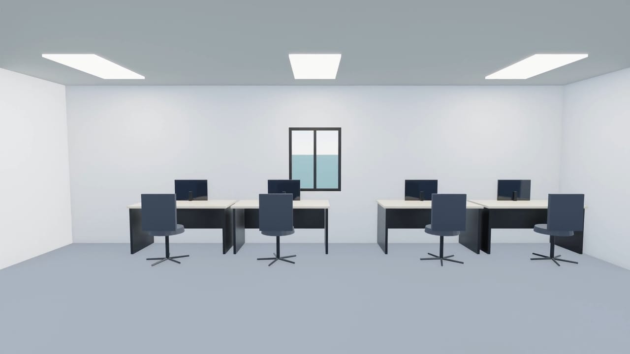 Open office floor with paired desks, monitors and task chairs facing a window